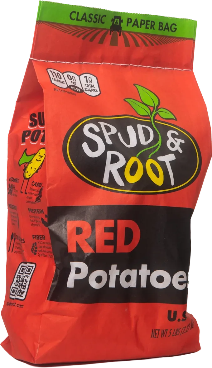 Spud & Root Red Potatoes: a bright red 5 lb paper bag with the black oval Spud & Root logo, a green sprout, and 'RED Potatoes' in a black band.