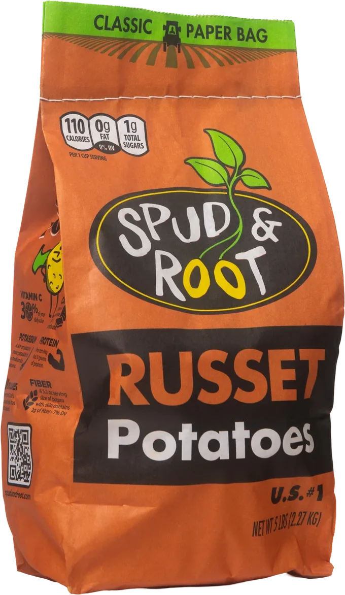 Spud & Root Russet Potatoes: a rust-orange 5 lb paper bag with the black oval Spud & Root logo, a green sprout, and 'RUSSET Potatoes' in a black band.